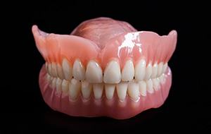 Full dentures on a black background